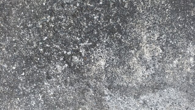 Weathered Gray Concrete Texture showing aged cement details and rough surface, excellent for abstract backgrounds, graphic resources, overlays, and architectural themes