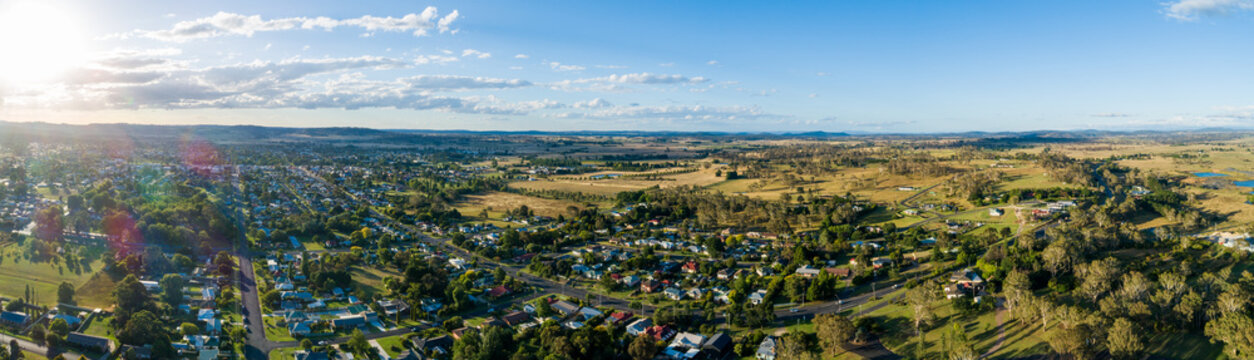 setting sun over landscape of well laid out streets of Glen Innes country town in Australia