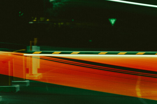 Parking barrier at night in a striking long-exposure