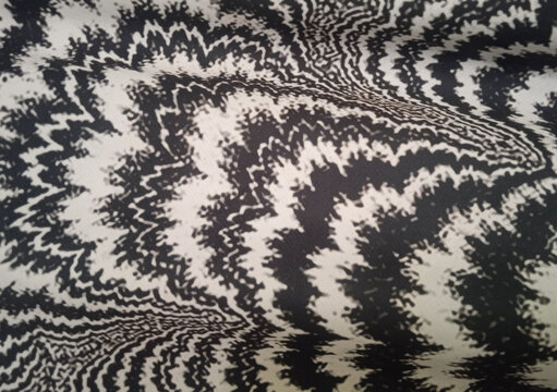 full frame texture of abstract black and white wavy pattern on fabric background