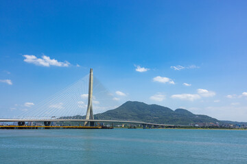 Fototapeta premium Danjiang Bridge over river in Tamsui Taiwan