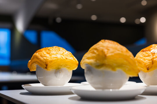 Creamy soup covered with crispy pastry lid