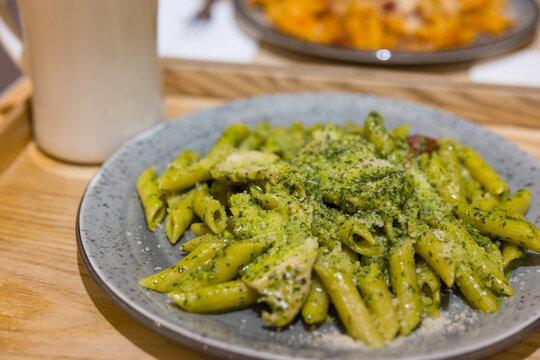 Fresh pesto sauce penne pasta on plate