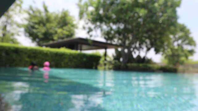 Abstract blur outdoor swimming pool in tropical resort hotel summer background