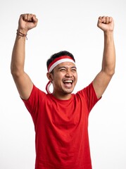 Naklejka premium A passionate young Indonesian man celebrating Independence Day, wearing a red and white headband and a red t shirt.