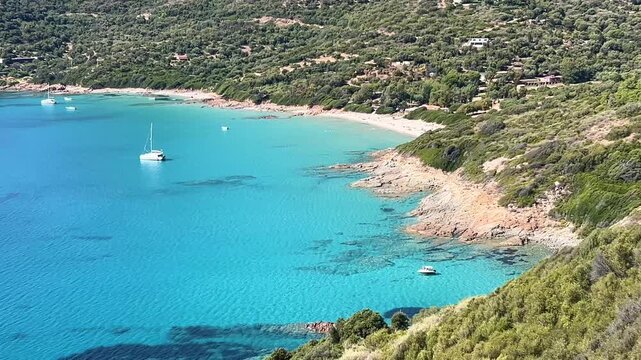 Corsica France panoramic view of beautiful coast with turquoise water bay and boats at sunny day.