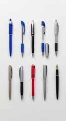 Fototapeta premium Assorted pens and pencils arranged on white background.