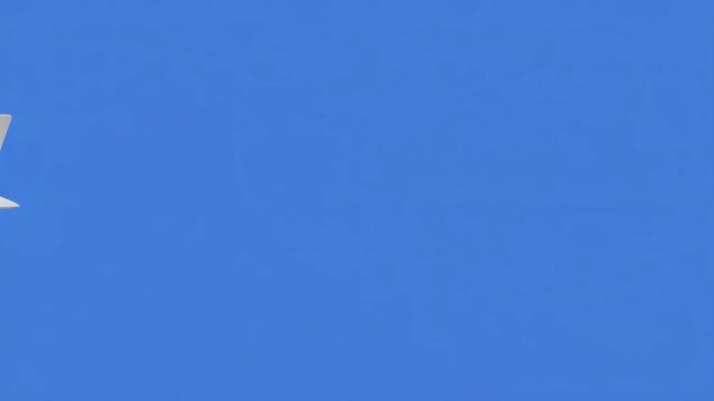 Airplane progression in blue sky with distinct stages of assembly and flight