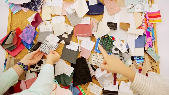 Fashion designer choosing fabric samples on a moodboard