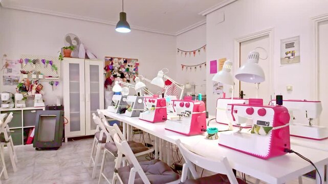 Empty sewing workshop with machines on table
