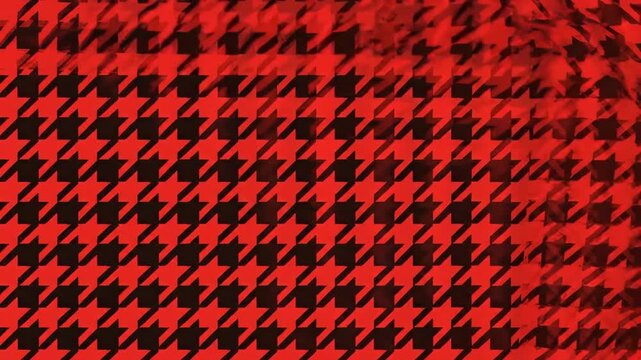 Seamless looping houndstooth pattern in bold red and black colors moving diagonally across the frame in a smooth motion