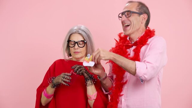 Eccentric senior couple taking pills and supplements for healthy longevity