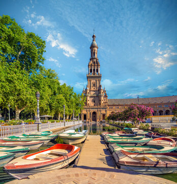 Boats in the Maria Luisa Park with the iconic towers of the Plaza de Espa&ntilde;a in the background, Seville, Andalusia, Spain