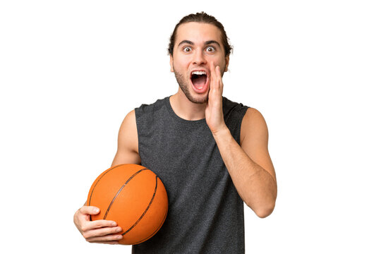 Young basketball player man over isolated background with surprise and shocked facial expression