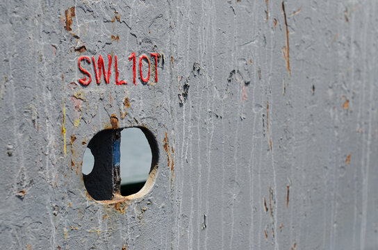 A cargo securing strong point integrated into the main deck bulwark of an offshore support vessel. The bulwark separates the cargo deck from the designated safe passage area