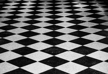 Obraz premium Checkered black and white diamond tiled floor pattern