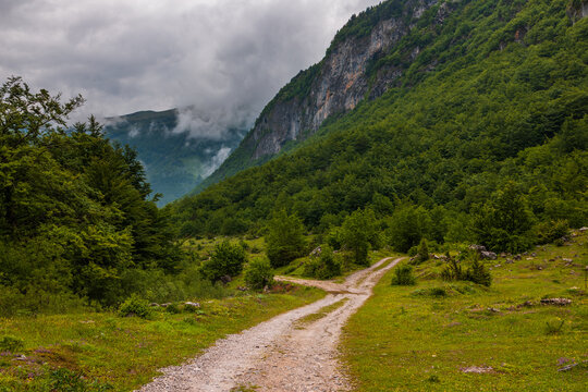 Dirt road splitting, leading through mountains in Gusinje, Montenegro