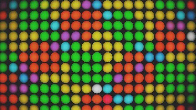 Abstract seamless video background showing a grid of bright flashing yellow, green, and orange spherical light bulbs.