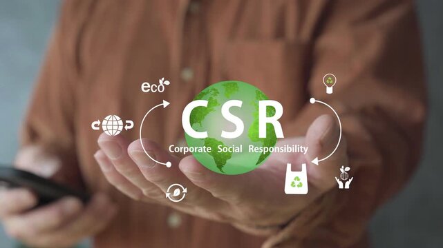 Close-up of a person presenting a glowing CSR globe with eco symbols, representing corporate social responsibility, sustainability, recycling, renewable energy, and environmental awareness.