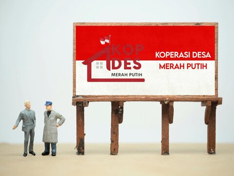 Indonesia - May 28, 2026 : Mini toy of action figure at outdoor with blur background. Miniature photography concept design. Minifigure of people with KOPERASI DESA MERAH PUTIH KDMP poster banner.
