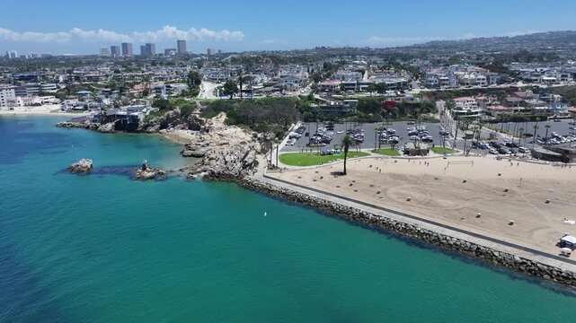 flying along Entrance Channel near Corona del Mar State Beach and Pirates Cove Beach, located in Corona del Mar, a seaside neighborhood in the city of Newport Beach, California 