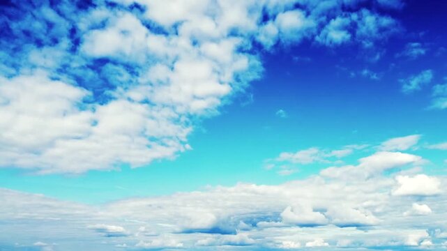 the beauty of the bright blue sky decorated with fluffy white clouds that move dynamically. 