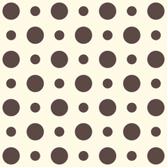 Minimalist seamless polka dot pattern with dark brown circles of varying sizes on a cream background © Ribath