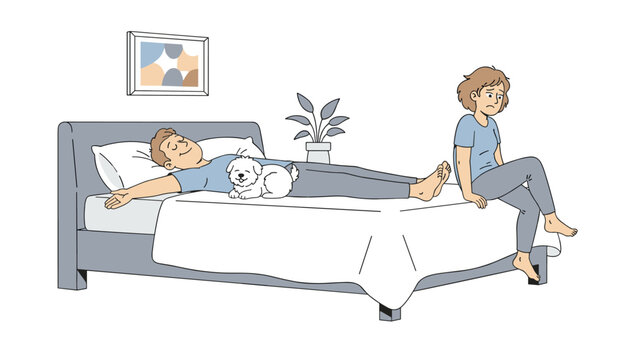 Sad unhappy woman sitting on the edge of the bed while her partner sleeps peacefully with a small dog in the center.