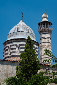 Striped black and white ablaq stone dome and minaret of Adana Grand Mosque, Turkey