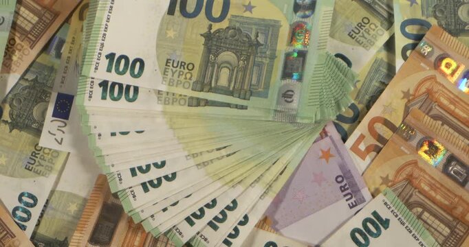 Money seen in banknotes on a table during the day