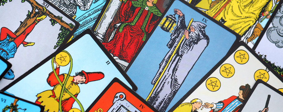 Big pile of different classical tarot cards on table. Pattern of tarot cards with traditional standard meanings
