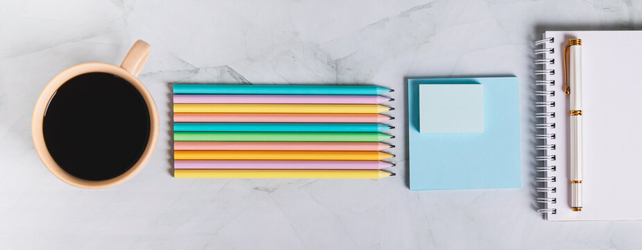 Colorful desk with stationery in trinket design style top view web banner