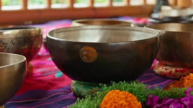 Tibetan singing bowls arranged, sound healing therapy, meditation instruments, vibrational wellness, acoustic therapy and spiritual healing.