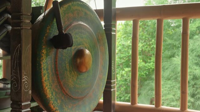Gong standing on the floor before the start of the gong ceremony in a gazebo
