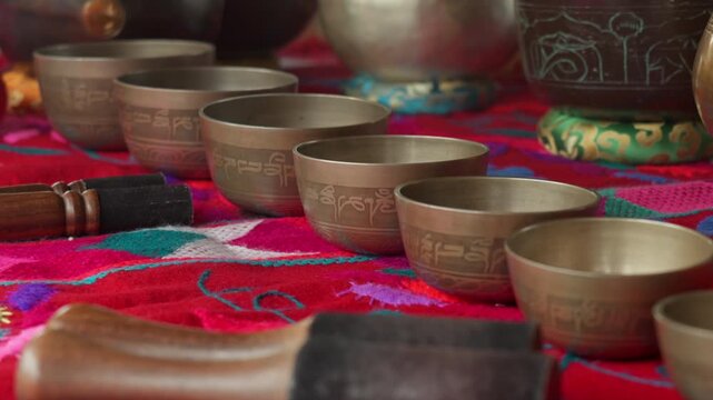 Tibetan singing bowls arranged, sound healing therapy, meditation instruments, vibrational wellness, acoustic therapy and spiritual healing.