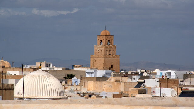 Minaret of the Great Mosque of Kairouan, above the skyline of the medina, in Kairouan, Tunisia