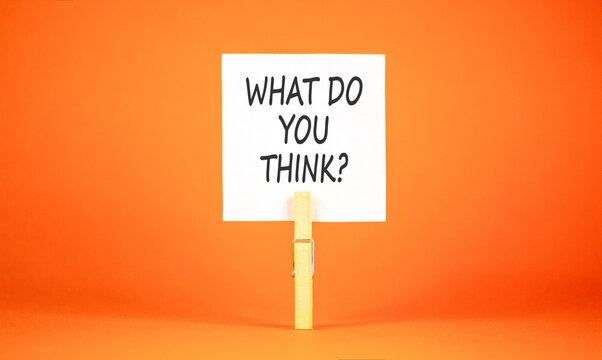 What do you think words symbol. Concept words What do you think on beautiful white paper on clothespin. Beautiful orange background. Business What do you think motivational support concept. Copy space