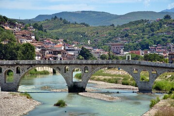 Berat, Albania, Gorica Bridge, Mangalem, Osum River, Ottoman architecture, Balkans, UNESCO World Heritage, old town, historic bridge, stone bridge, travel photography, Albanian tourism, city of window © Kuzan