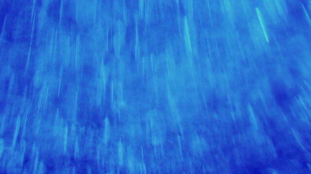 Dense Swirling Bokeh Mist Surging Upward and Slowing Down in Deep Electric Blue - Abstract Motion Background⁠