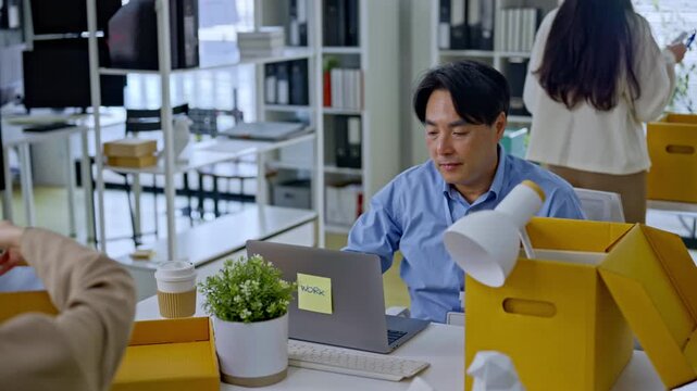Asian businessman packing into cardboard box due to job layoff,worker replaced by AI automation,career retirement,ai disruption and modern technology,Digital Disruption,Document Management Data System