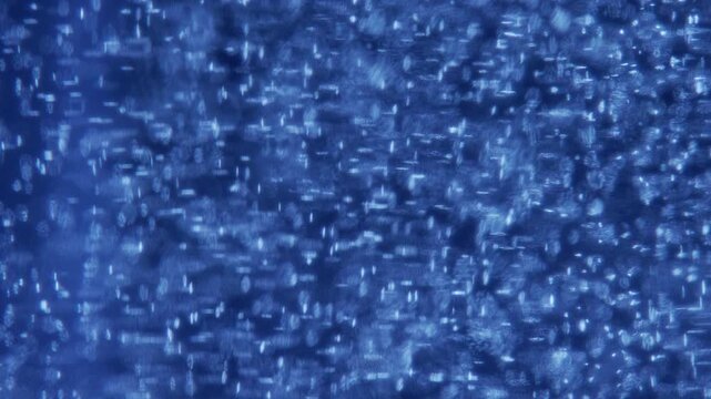 Multi Sized Bokeh Bubbles Floating Upwards and Fading in Deep Blue - Airy Abstract Motion Background⁠