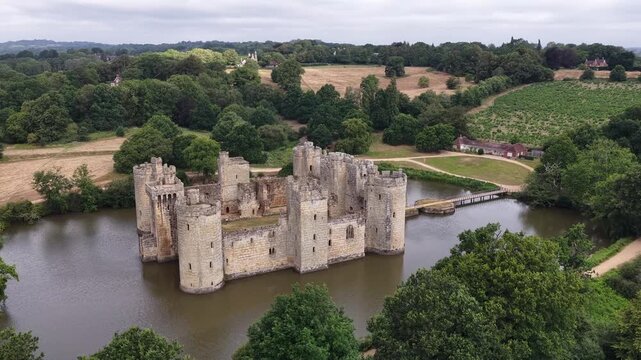 Aerial view of Bodiam Castle surrounded by a moat in Sussex during a summer afternoon