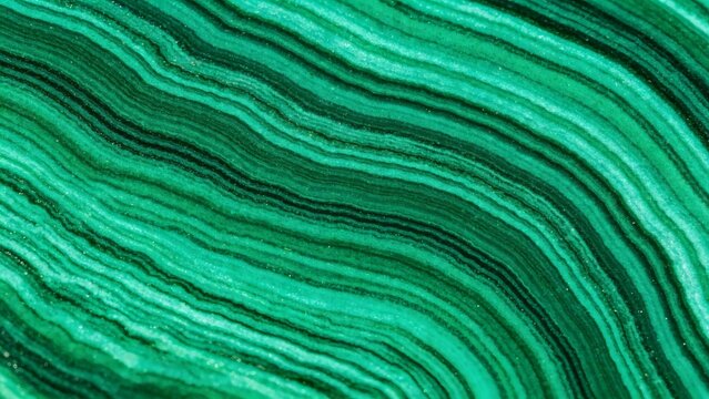 Polished malachite green mineral surface filling entire frame