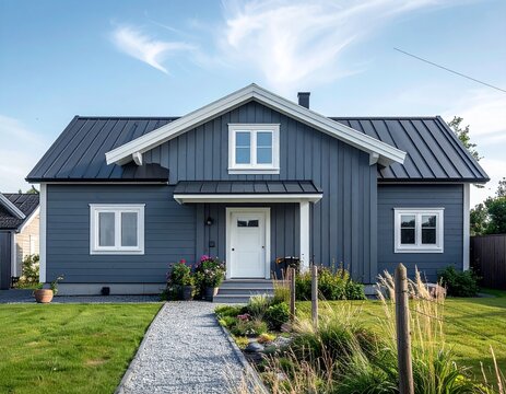 Classic gable roof house with painted wooden exterior and white windows