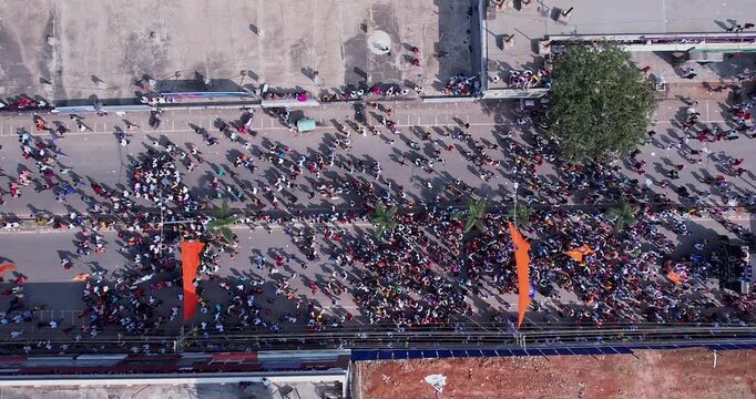 Drone top view of massive people marching and celebrating during immersion of lord Ganesha