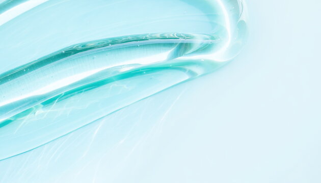 Clear liquid gel texture dynamic wave on light blue background 薄青い背景に広がる透明なジェル液体のダイナミックなウェーブ