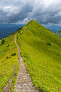 the summit called "Gehrenspitze" in the little valley of Walser, Austria on a cloudy summer day. hiker walking a tightrope up under changing weather. holiday destination for hiker and climber