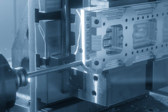 Horizontal CNC milling machine performing a precision hole drilling process on an aluminum part.