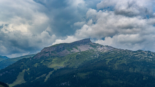 the summit called "Hoher Ifen" in the little valley of Walser, Austria on a cloudy summer day. hiker walked up under changing weather. holiday destination for hiker and climber and in winter skiing