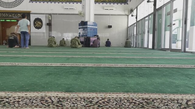 arab man walking in a mosque
